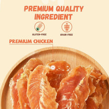 Chicken jerky dog treats in wooden bowl, sliced orange chicken strips