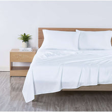 White microfiber bed sheet set with pillowcases and flat sheet on bed