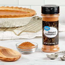 Ground cinnamon spice jar with a small bowl of ground spice