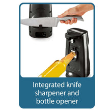 Black electric can opener with knife sharpener and bottle opener, hand using lever