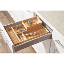 Natural bamboo drawer organizer insert with separate sections for kitchen tools