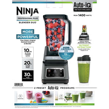 Countertop blender duo with clear pitcher, dark lid, and control panel filled with berry smoothie