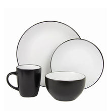 Two-tone coupe dinnerware: black mug, black bowl, white dinner plate with dark rim
