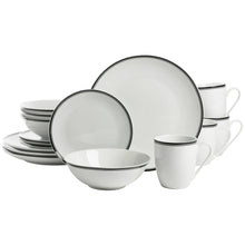 Ceramic dinnerware set with black-rim plates, bowls, and mugs