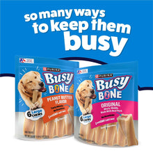 Busy Bone dog chew treats variety display showing large and smaller bags with beige bones