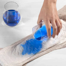 Absorbent incontinence pad with blue liquid spread on white pad surface
