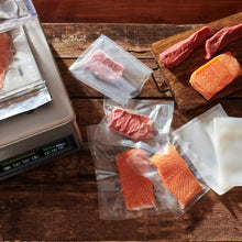 Maxvac Pro chamber sealer bags, clear vacuum bags filled with meat and salmon
