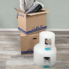 Clear plastic bubble cushion rolls protecting moving boxes on a floor