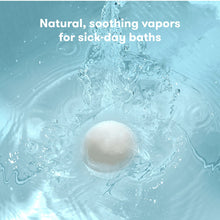 White vapor bath bomb floating in water with bubbles