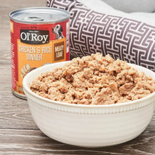 Wet dog food can behind bowl of chunky meat loaf dog food