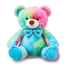 Multicolor bear plush toy with blue patterned bow tie, sitting with round paws forward.