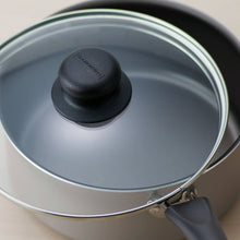 Tramontina covered non-stick saucepan with glass lid and black knob