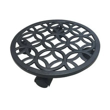 Black round plant caddy with ornate lattice tray and front support foot