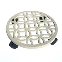 Off-white round plant caddy with decorative lattice top and three support feet