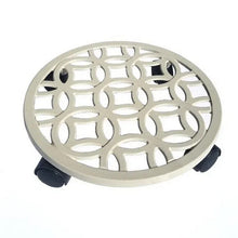 Off-white plant caddy top view with lattice cutouts and three black feet