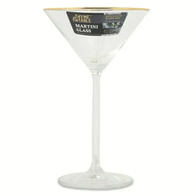 Gold-rim martini glass with clear bowl and printed branding label near rim