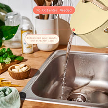 Buttercream ceramic nonstick pot pouring into sink with built-in pour spouts and strainer lid