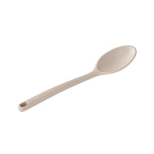 Beige ceramic measuring spoon with shallow bowl