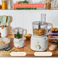 White 3-cup food chopper with clear bowl on countertop, with matching base