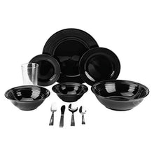 Black round plates and bowls with serving utensils and drinkware cups