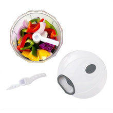 White quick pull chopper bowl with mixed chopped vegetables and center blade