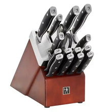 Knife block set with black-handled knives in red wooden block