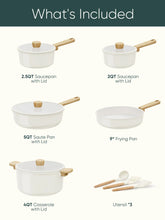 White cookware set pieces: saucepans and frying pan with wooden handles