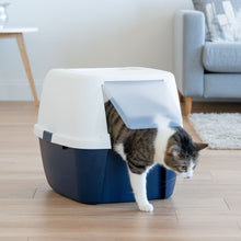 Navy and white covered cat litter box with front flap open as a cat enters