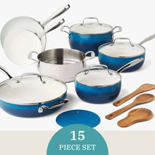 Denim blue ceramic non-stick cookware set with stainless steel lids, handles, and wooden utensils