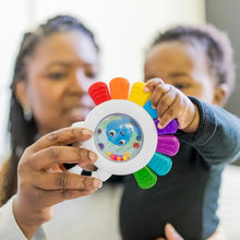 Octopus chillable rattle and teether held up with rainbow arms and face window
