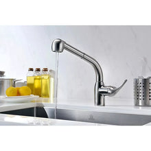 Brushed nickel single-handle kitchen faucet with pull-out spray head releasing water.