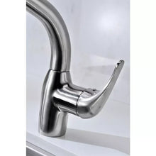 Brushed nickel single-handle kitchen faucet with pull-out sprayer docked beside spout.