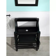 Black bathroom vanity with open cabinet doors and lower storage shelf.