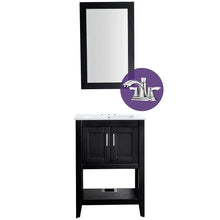 Black bathroom vanity with white top, mirror, and deck faucet.