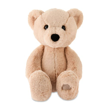 Cuddle bear plush toy with black eyes and round nose, beige fur, paw patch.