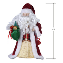 Santa tree topper doll with red hat and white fur, red coat, gold dress; 12 in height shown