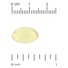 Yellow omega softgel with measurement scale in cm and inches