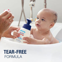 Aquaphor Baby wash & shampoo bottle in bath, with hands and baby