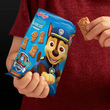 Cinnamon graham snack package in hand with Paw Patrol graphics and crackers
