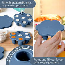 Blue silicone feeder tray being filled with food puree and caps