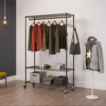 Bronze rolling garment rack with hanging bar, two wire shelves, and caster wheels, garments