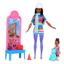 Ice skating fashion doll with blue striped outfit, pink ice stand, and child doll