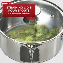 Stainless steel lid with straining holes and pour spout over sauce pan