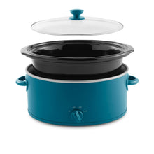 Blue oval slow cooker with black crock, glass lid, and teal side handles