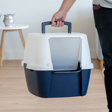 Navy and white enclosed cat litter box with front flap and raised top handle