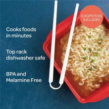 Red microwave ramen cooker tray with chopsticks and cooked noodles inside