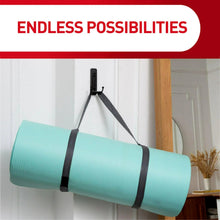 Adhesive hook system holding a rolled mat on a wall