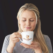 Cup of Gloria Jean's butter toffee flavored coffee held for serving