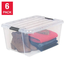 Clear plastic storage bin with black buckle latches, open top holding folded blankets