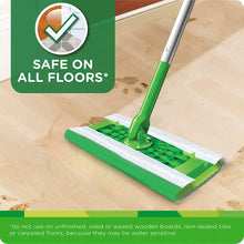 Wet mopping cloth on mop head with green handle for safe all-floor use